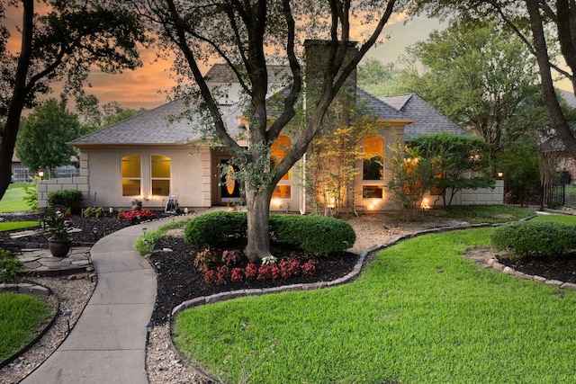 1450 Meandering Way, Rockwall, TX 75087 - view of front of house with a front yard, roof with shingles, and stucco siding