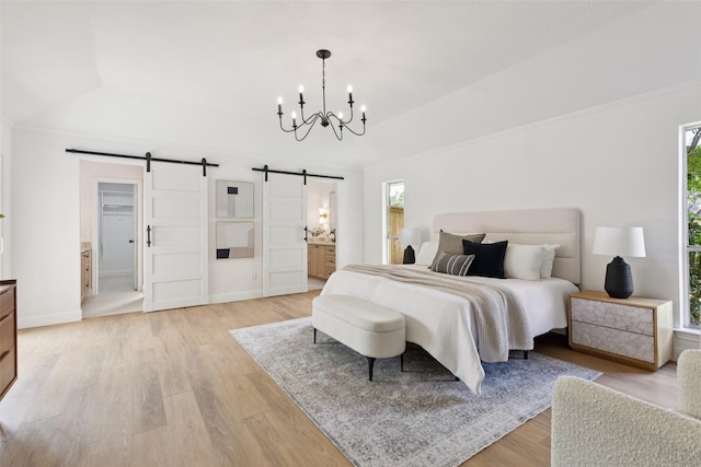 1100 Longworth Dr, Plano, TX 75075 - bedroom with a barn door, a chandelier, light wood-type flooring, vaulted ceiling, and connected bathroom