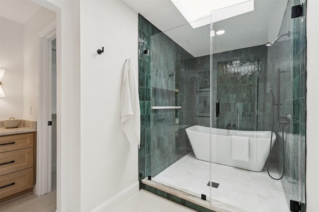 1100 Longworth Dr, Plano, TX 75075 - full bathroom featuring a freestanding bath, a shower stall, vanity, and tile patterned floors