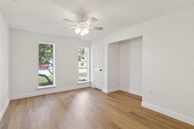 1100 Longworth Dr, Plano, TX 75075 - empty room with wood finished floors and a ceiling fan