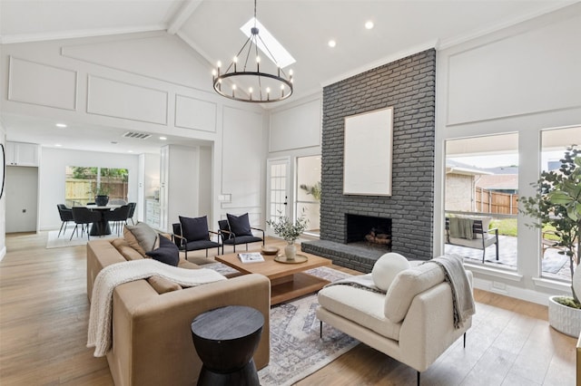 1100 Longworth Dr, Plano, TX 75075 - living room with a chandelier, a brick fireplace, light wood finished floors, high vaulted ceiling, and beamed ceiling
