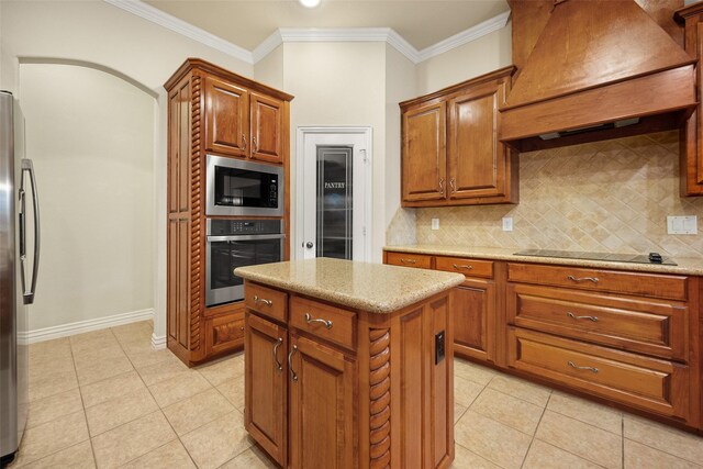 220 Arbor Ln, Haslet, TX 76052 - kitchen with appliances with stainless steel finishes, premium range hood, tasteful backsplash, light tile patterned floors, and crown molding