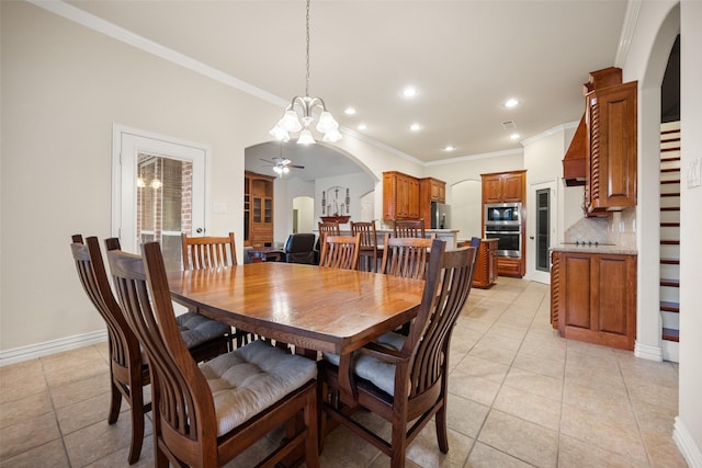 220 Arbor Ln, Haslet, TX 76052 - dining room featuring arched walkways, a chandelier, light tile patterned floors, ornamental molding, and a ceiling fan