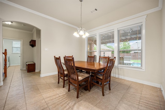 220 Arbor Ln, Haslet, TX 76052 - dining space with arched walkways, crown molding, light tile patterned flooring, and a chandelier
