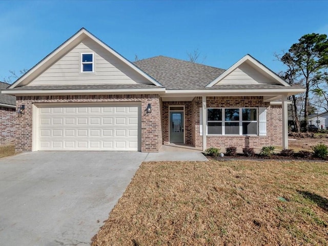 106 Saddle Brook Dr, Lufkin, TX 75904 - view of front facade featuring brick siding, driveway, a front lawn, roof with shingles, and a garage