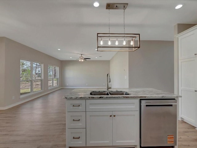 106 Saddle Brook Dr, Lufkin, TX 75904 - kitchen with dishwasher, light wood-style floors, ceiling fan, open floor plan, and white cabinetry