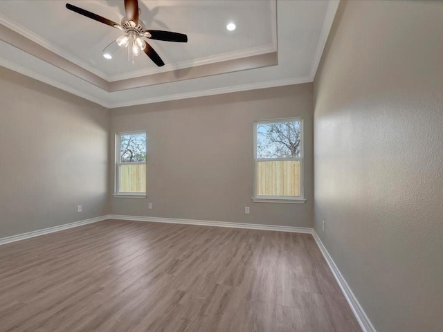 106 Saddle Brook Dr, Lufkin, TX 75904 - empty room with wood finished floors, healthy amount of natural light, a raised ceiling, ceiling fan, and crown molding