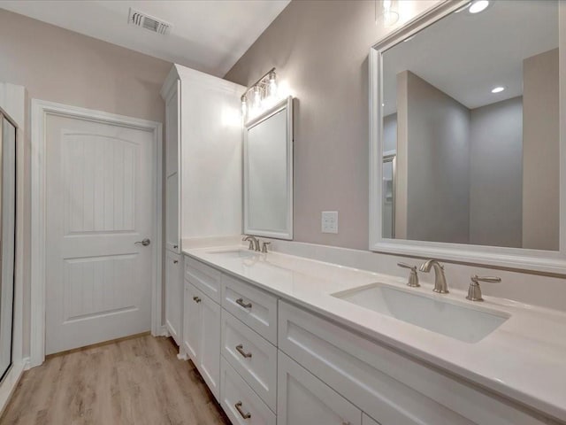 106 Saddle Brook Dr, Lufkin, TX 75904 - bathroom with double vanity and wood finished floors