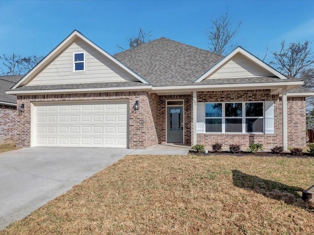 106 Saddle Brook Dr, Lufkin, TX 75904 - view of front of home with brick siding, a front lawn, driveway, roof with shingles, and a garage