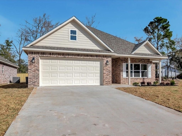 106 Saddle Brook Dr, Lufkin, TX 75904 - view of front facade featuring brick siding, concrete driveway, a front lawn, and a shingled roof