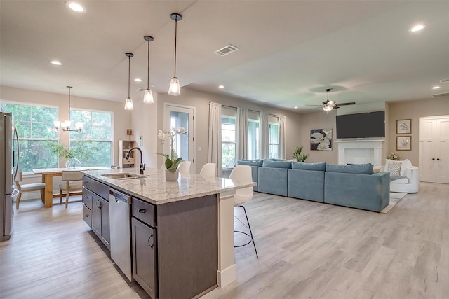 619 Latigo Ct, Weatherford, TX 76088 - kitchen featuring stainless steel appliances, ceiling fan, recessed lighting, healthy amount of natural light, and a chandelier