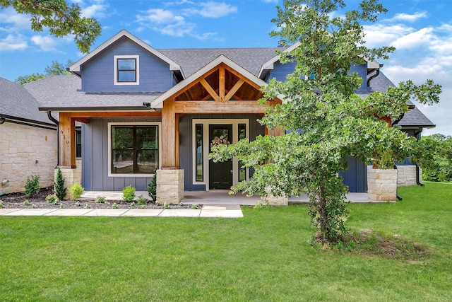 619 Latigo Ct, Weatherford, TX 76088 - craftsman-style home with a shingled roof, board and batten siding, a front yard, and covered porch