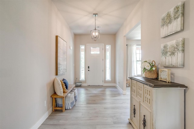 619 Latigo Ct, Weatherford, TX 76088 - entrance foyer featuring light wood-style floors and a chandelier