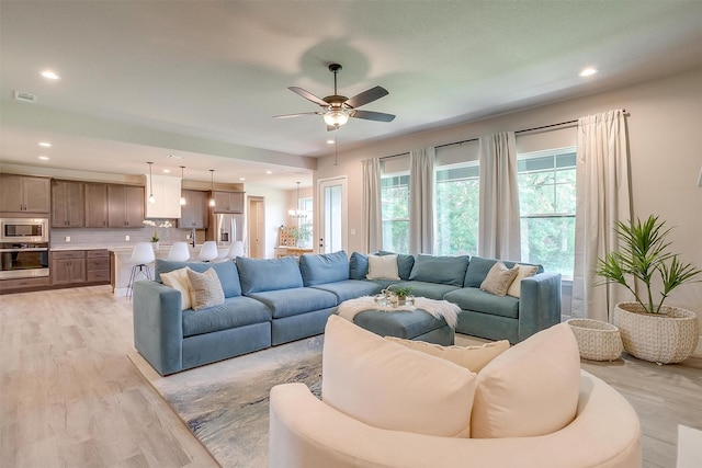 619 Latigo Ct, Weatherford, TX 76088 - living room with light wood-style flooring, a ceiling fan, and recessed lighting