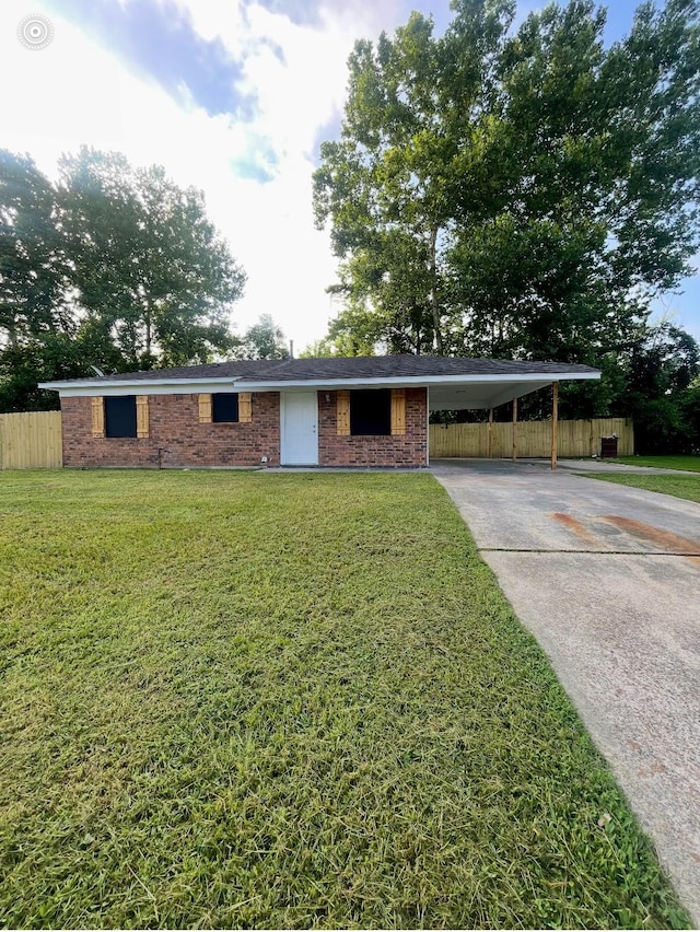 624 Horton, Minden, LA 71055 - view of front facade featuring driveway, a carport, and brick siding