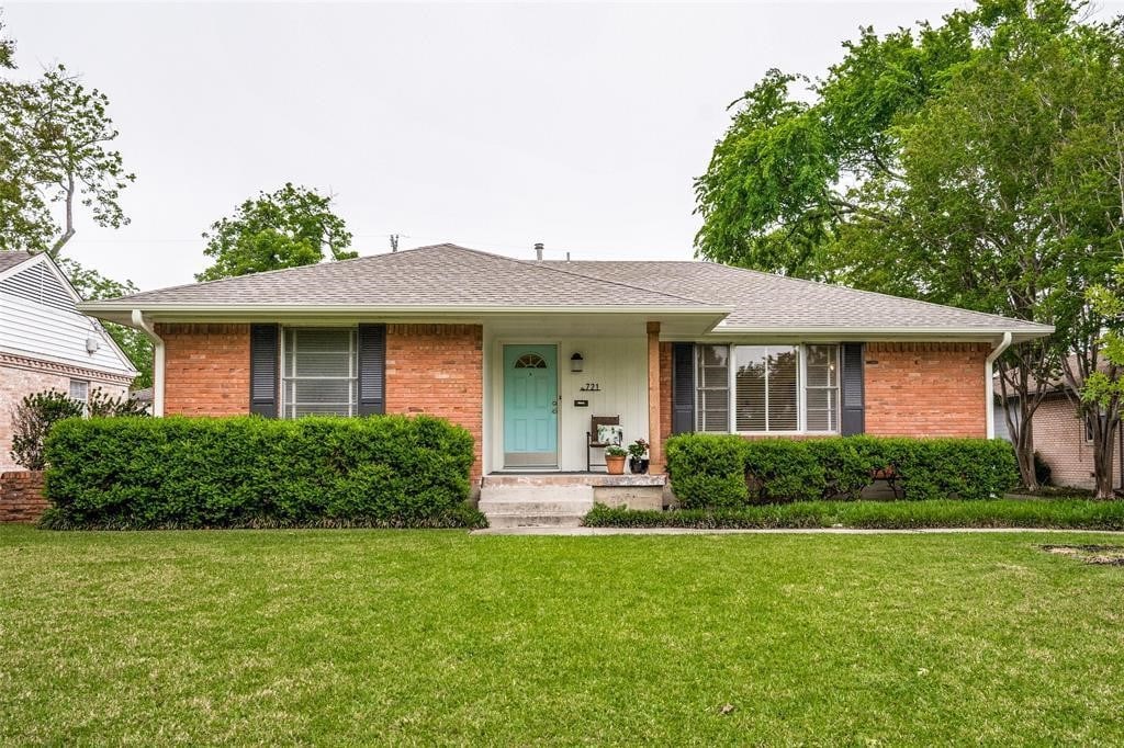 721 Sherwood Dr, Richardson, TX 75080 - view of front of property featuring brick siding, a front lawn, and a shingled roof