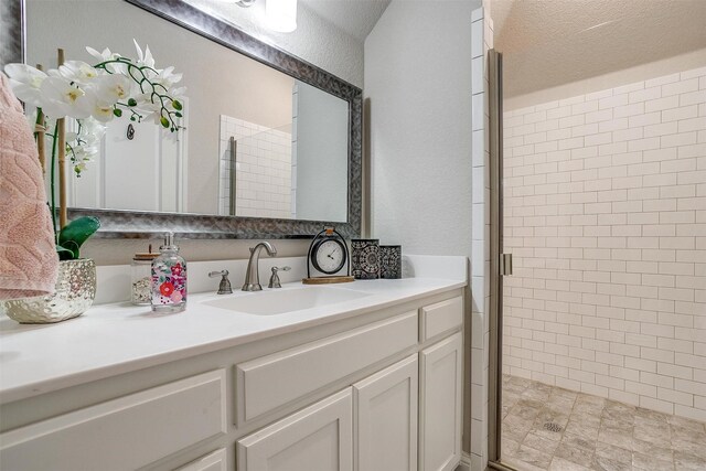 404 Bluffside Trl, Benbrook, TX 76126 - full bath featuring vanity, a shower stall, and a textured wall