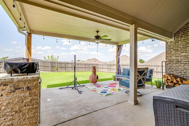 404 Bluffside Trl, Benbrook, TX 76126 - fenced backyard featuring a patio, ceiling fan, grilling area, and an outdoor living space