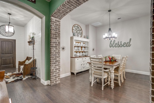404 Bluffside Trl, Benbrook, TX 76126 - dining space with a chandelier, dark wood-style floors, and arched walkways