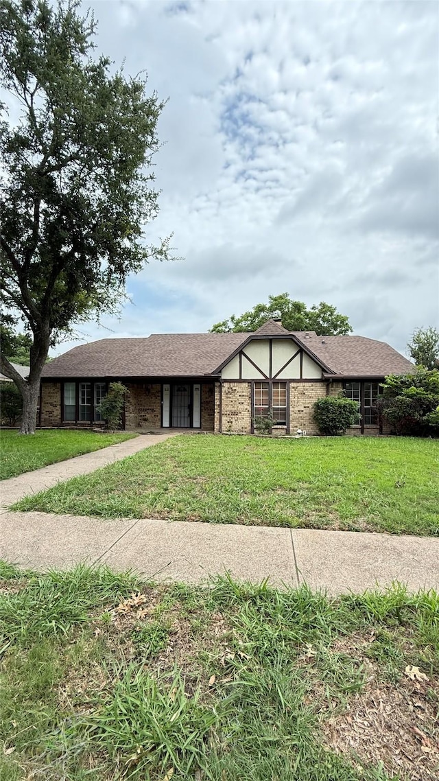 1705 Morningstar Trl, Richardson, TX 75081 - view of front facade with a front lawn and driveway