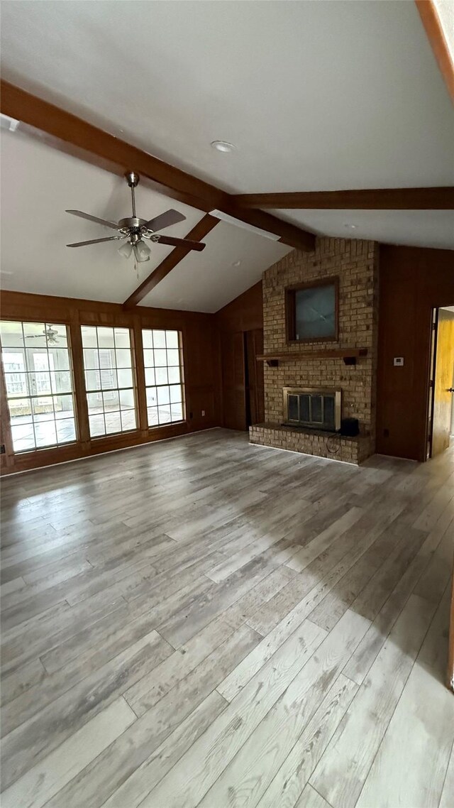 1705 Morningstar Trl, Richardson, TX 75081 - unfurnished living room with wood finished floors, a ceiling fan, and a brick fireplace