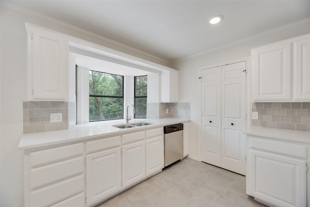 3801 Woodside Dr, Arlington, TX 76016 - kitchen featuring dishwasher, backsplash, white cabinets, crown molding, and light countertops