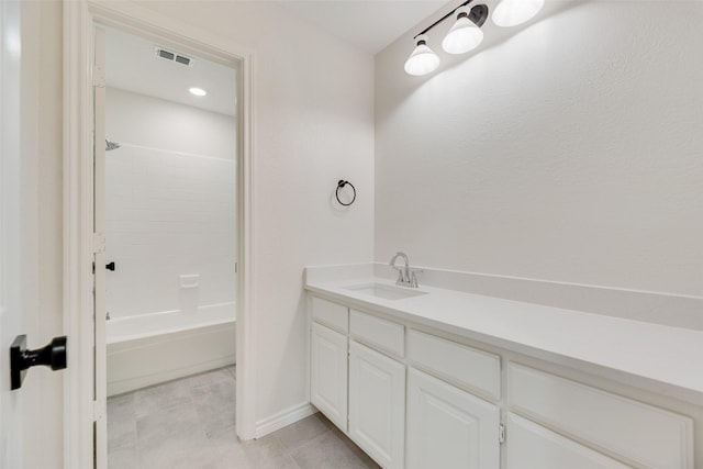 3801 Woodside Dr, Arlington, TX 76016 - full bathroom featuring vanity, tile patterned floors, and bathtub / shower combination