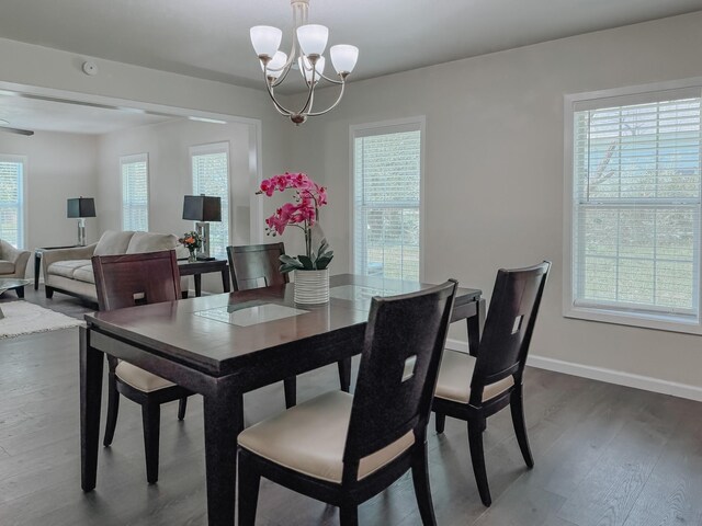 1605 N Beaton St, Corsicana, TX 75110 - dining room featuring a chandelier and dark wood-type flooring