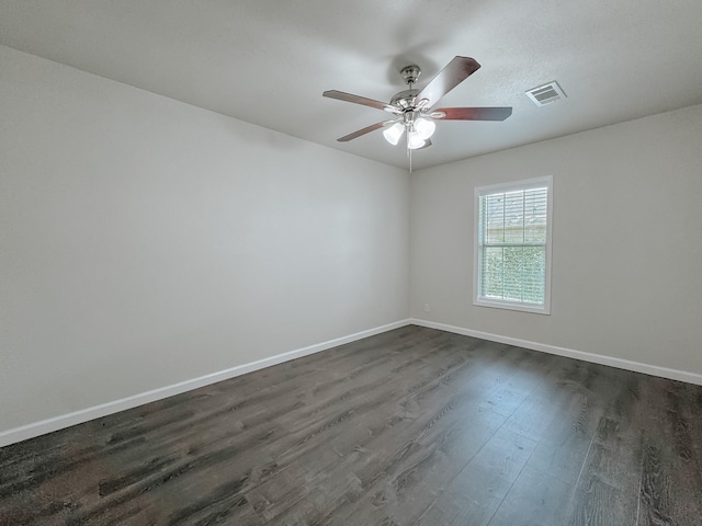 1605 N Beaton St, Corsicana, TX 75110 - spare room with dark wood-type flooring and a ceiling fan