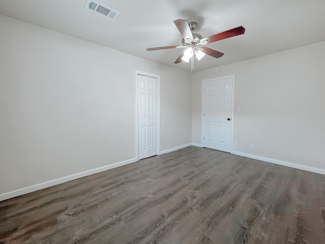 1605 N Beaton St, Corsicana, TX 75110 - unfurnished room with a ceiling fan and dark wood-style floors