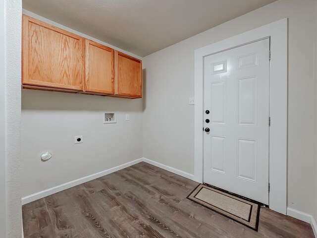 1605 N Beaton St, Corsicana, TX 75110 - washroom featuring washer hookup, electric dryer hookup, cabinet space, and wood finished floors