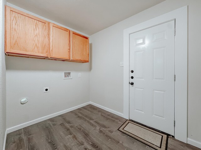 1605 N Beaton St, Corsicana, TX 75110 - washroom with hookup for a washing machine, hookup for an electric dryer, dark wood finished floors, and cabinet space