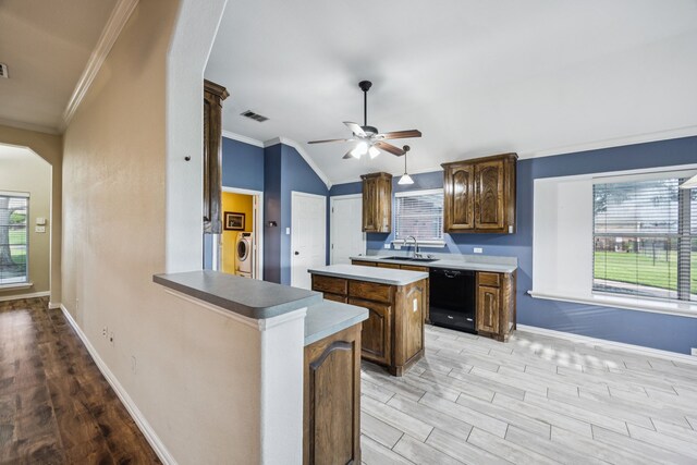 700 Lake Vista Ln, Lavon, TX 75166 - kitchen with black appliances, ceiling fan, light wood-style flooring, a kitchen island, and light countertops
