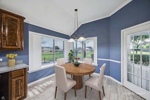 700 Lake Vista Ln, Lavon, TX 75166 - dining space featuring vaulted ceiling, ornamental molding, healthy amount of natural light, light wood-style flooring, and a chandelier