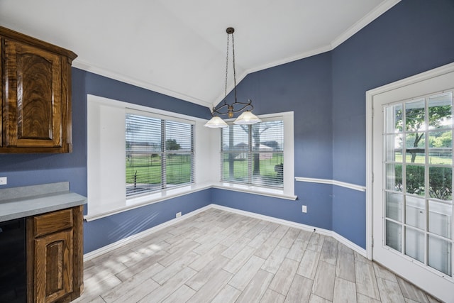 700 Lake Vista Ln, Lavon, TX 75166 - dining space featuring vaulted ceiling, ornamental molding, healthy amount of natural light, light wood-style flooring, and a chandelier