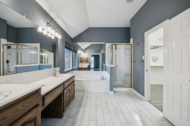 700 Lake Vista Ln, Lavon, TX 75166 - full bath featuring a shower stall, a garden tub, vaulted ceiling, vanity, and a spacious closet