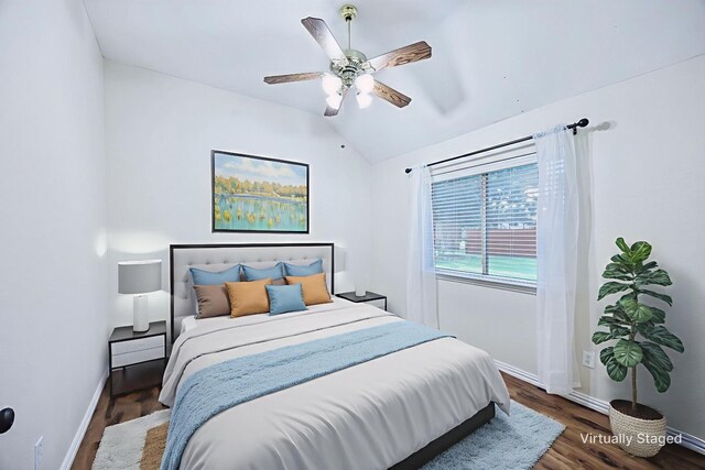 700 Lake Vista Ln, Lavon, TX 75166 - bedroom featuring wood finished floors, lofted ceiling, and a ceiling fan