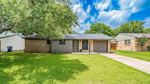 217 Wintercrest Rd, Burleson, TX 76028 - ranch-style home with concrete driveway, brick siding, a front lawn, and an attached garage