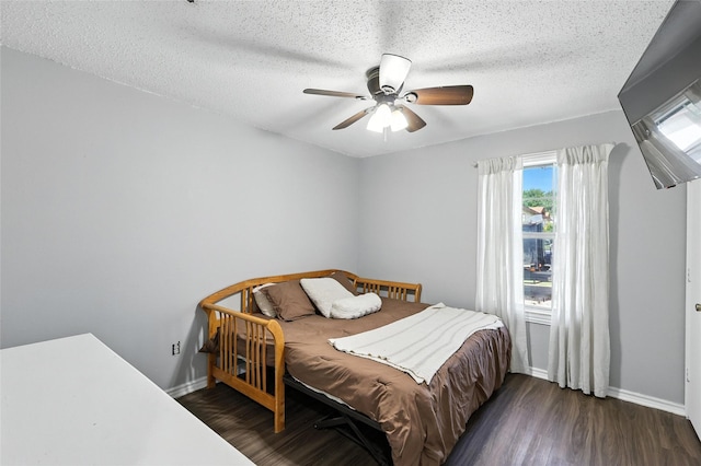 1471 Stony Valley Dr, Ponder, TX 76259 - bedroom featuring dark wood-style floors, a textured ceiling, and ceiling fan