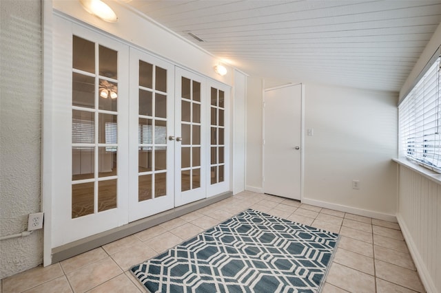 1810 Socorro Ln, Irving, TX 75061 - entryway featuring tile patterned floors, french doors, and wood ceiling