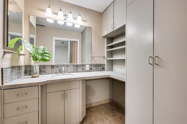 1810 Socorro Ln, Irving, TX 75061 - bathroom with vanity, tile patterned floors, and tasteful backsplash