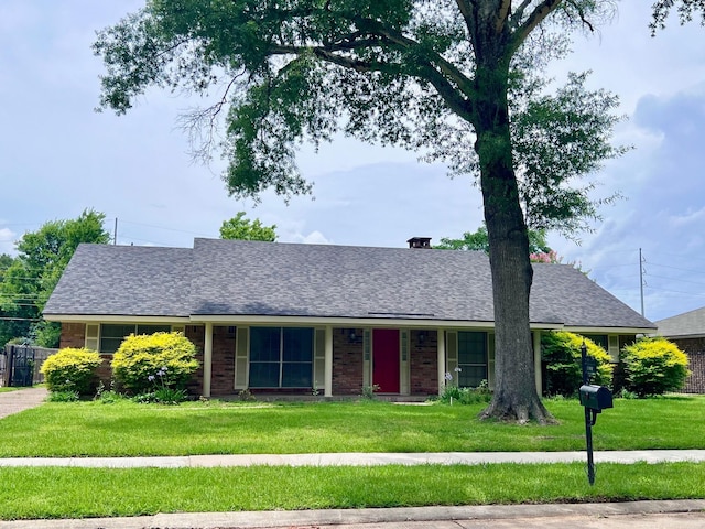 8610 W Wilderness Way, Shreveport, LA 71106 - ranch-style home featuring a front lawn, roof with shingles, and brick siding
