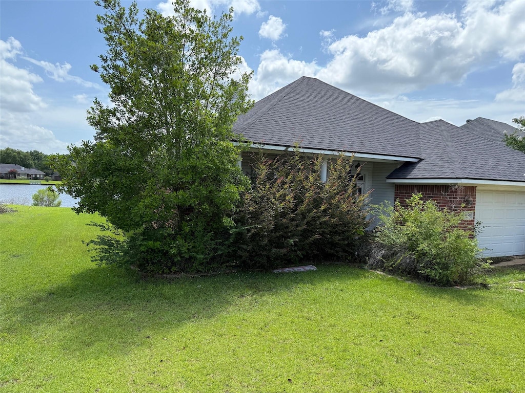 3650 Crestview Dr, Shreveport, LA 71110 - view of green lawn featuring a garage