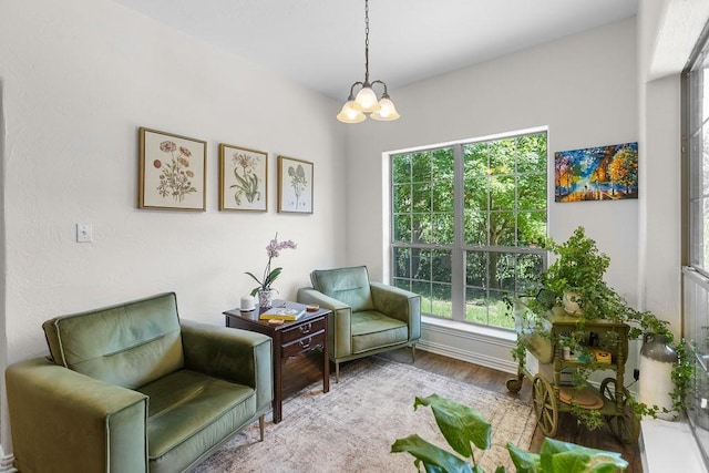 2110 Park Rdg, Denison, TX 75020 - living area featuring a chandelier, plenty of natural light, and wood finished floors