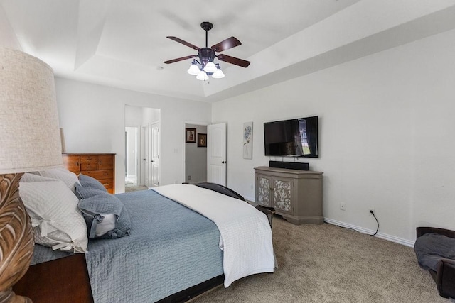 2110 Park Rdg, Denison, TX 75020 - bedroom featuring a tray ceiling, carpet floors, and ceiling fan