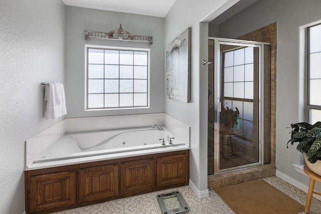 2110 Park Rdg, Denison, TX 75020 - full bath featuring plenty of natural light, a shower stall, and a whirlpool tub