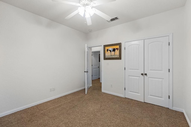 2110 Park Rdg, Denison, TX 75020 - unfurnished bedroom with carpet flooring, a closet, and a ceiling fan