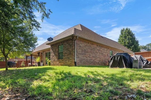 2110 Park Rdg, Denison, TX 75020 - view of side of home featuring brick siding and roof with shingles