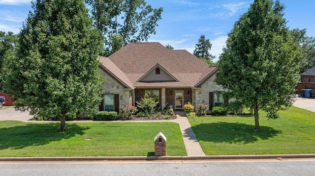 2110 Park Rdg, Denison, TX 75020 - view of front facade featuring stone siding and a front yard