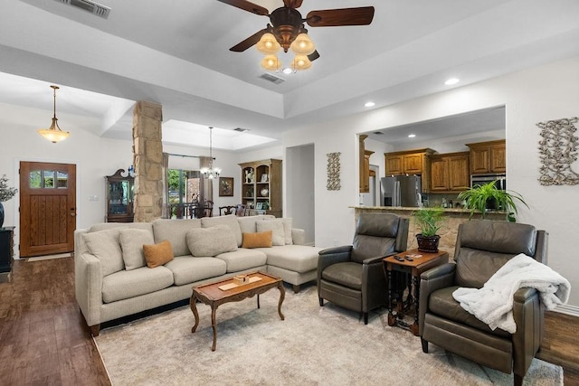 2110 Park Rdg, Denison, TX 75020 - living area featuring wood finished floors, recessed lighting, decorative columns, a ceiling fan, and a chandelier